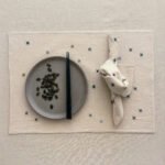 NOON linge de table ecru finition aqua par Valérie Barkowski