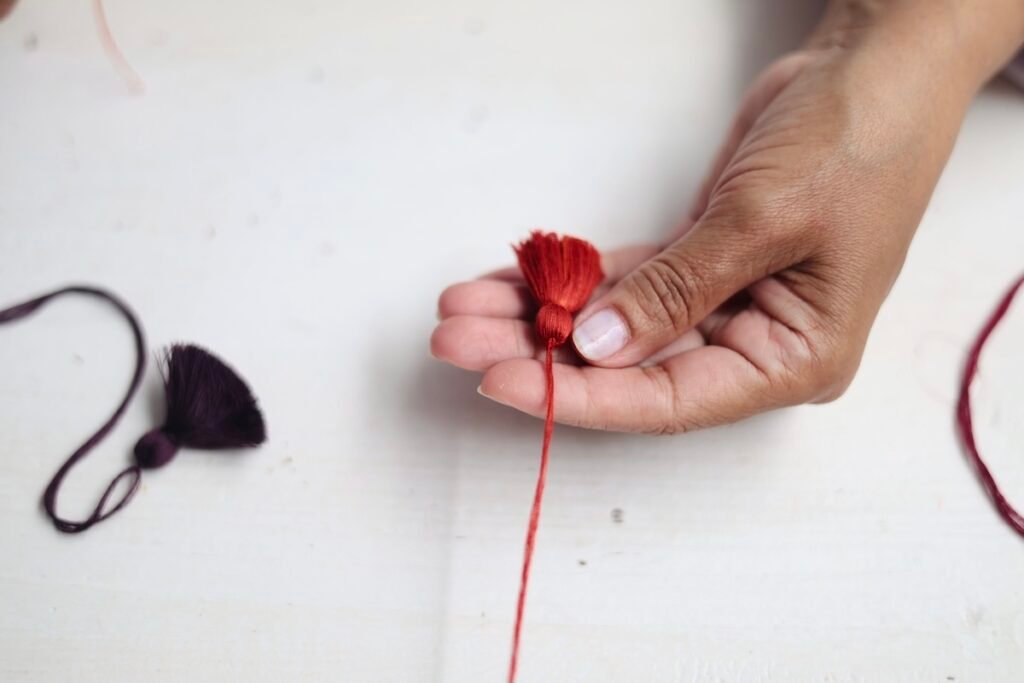 making of the pompons in Valerie Barkowski's atelier